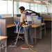 ProTeam GoFit 3 backpack vacuum in use between office cubicles
