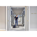 Nilfisk VP400 HEPA vacuuming a hotel hallway carpet