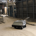 Tomcat GT sweeper working on a dusty industrial plant floor