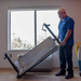 EDIC 7000AC PTAC cradle tilted by a technician in a room