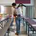 ProTeam GoFit 6 backpack vacuum in use in a cafeteria