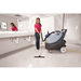 Advance All Cleaner XP vacuuming a restroom floor