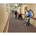 Clarke Comfort Pak 6 vacuuming a nursing home hallway