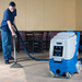 EDIC Galaxy 2000 cleaning carpet with a Glidemaster wand
