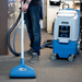 EDIC Galaxy 2000 cleaning carpet with a Triton wand