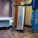 EDIC 7000AC PTAC cradle rolled upright beside a wall unit