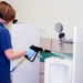 EDIC CR2 spray gun rinsing a restroom urinal