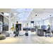Nilfisk VP300 HEPA vacuuming an open office floor