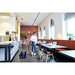 Nilfisk VP400 HEPA vacuuming a restaurant floor