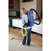 Clarke Comfort Pak 6 operator vacuuming carpet, rear view