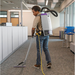 ProTeam GoFit 10 backpack vacuum in use on office carpet