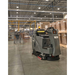 Karcher KIRA B100 R autonomous scrubber cleaning a warehouse