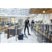 Nilfisk VP300 HEPA vacuuming a hotel bar area floor
