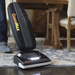 CleanMax Zoom ZM-800 vacuuming a rug with headlight on