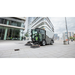 Karcher MC 250 sweeping a plaza by office buildings