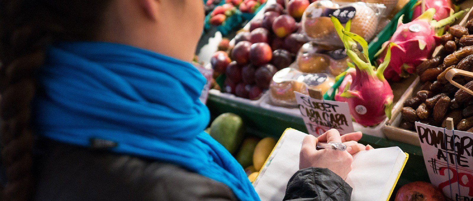 Artist sketching fruit at market