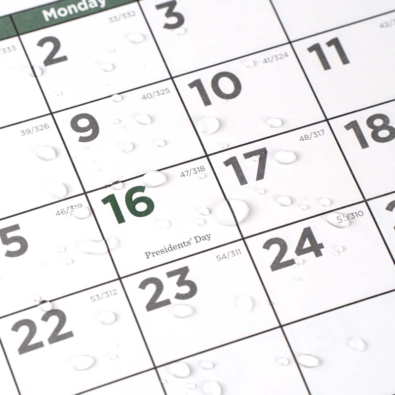 Wall calendar with spill on it.