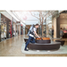 Nilfisk GD 5 Battery backpack vacuum used on mall seating