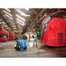 Nilfisk MH 4M pressure washer washing a bus in a bus depot