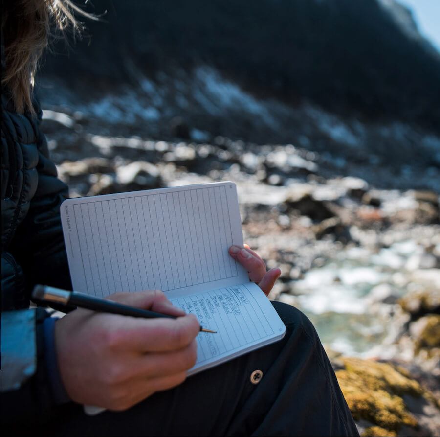 mountaineer taking notes