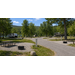 Commercial fire rings installed throughout a campground loop