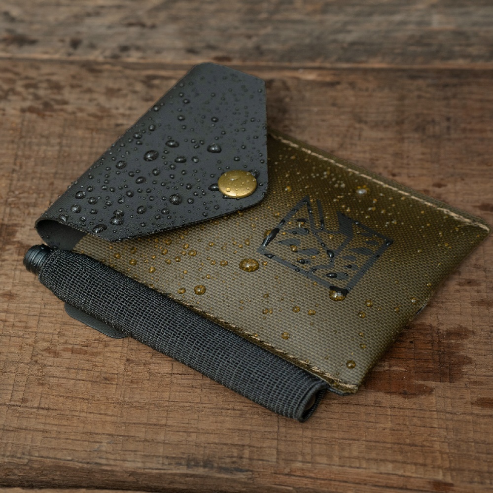 Monsoon OTG Wallet with pen, OTG Notebook, and water droplets