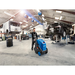Nilfisk MH 4M pressure washer pushed through an auto repair shop