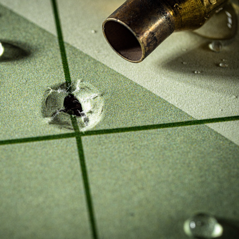 Close up of bullet hole and casing.