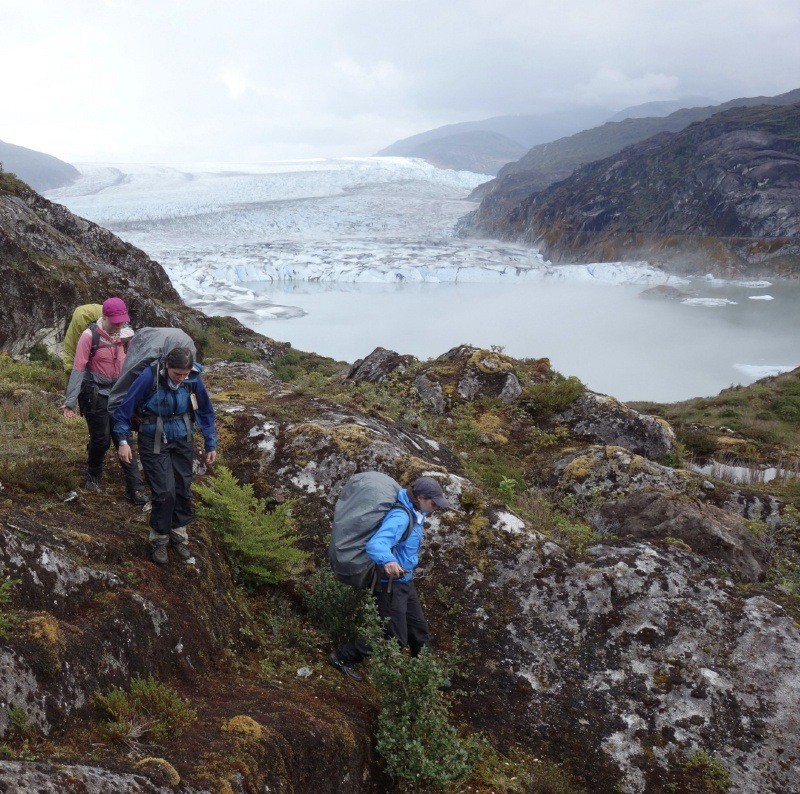 Students backpacking above a glacier.